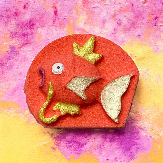 Pokémon prize Magikarp bath bomb - Charming Cheshires, toy, pink pomelo, mandarin oranges, passion fruit, laelias blooms, bamboo, palm leaves